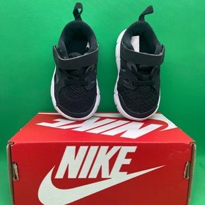 Nike sneakers size 4c, color black and white only one time used.